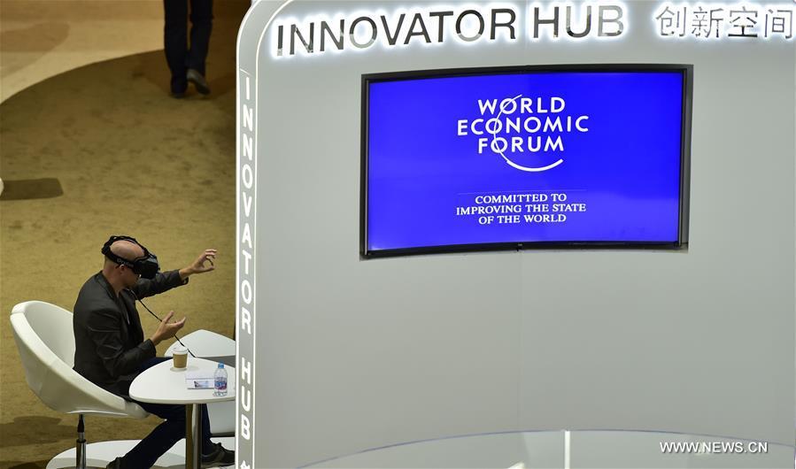 Visitors try at exploration zone on Summer Davos Forum in Tianjin(1/10)