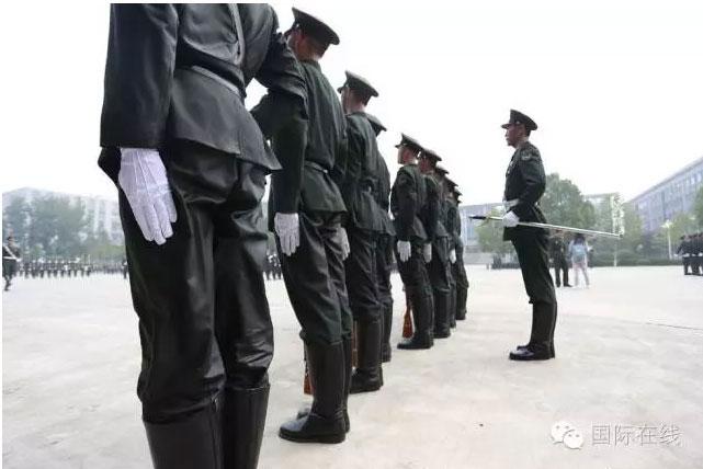 Soldiers completely drenched after a half day training session on July 29, 2016, ahead of Chinese Army Day on August 1. (Photo/CRIENGLISH.com)