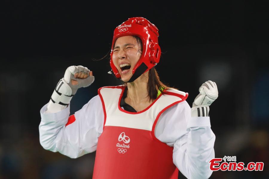 Zheng Shuyin wins olympic women's 67kg taekwondo gold(1/6)