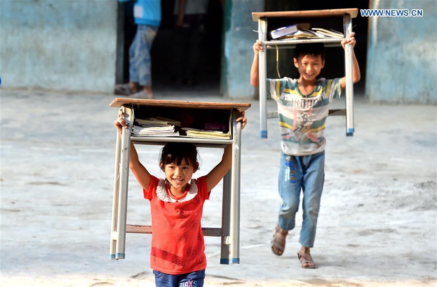 Guangxi to further boost education quality in poverty-stricken areas(1/4)