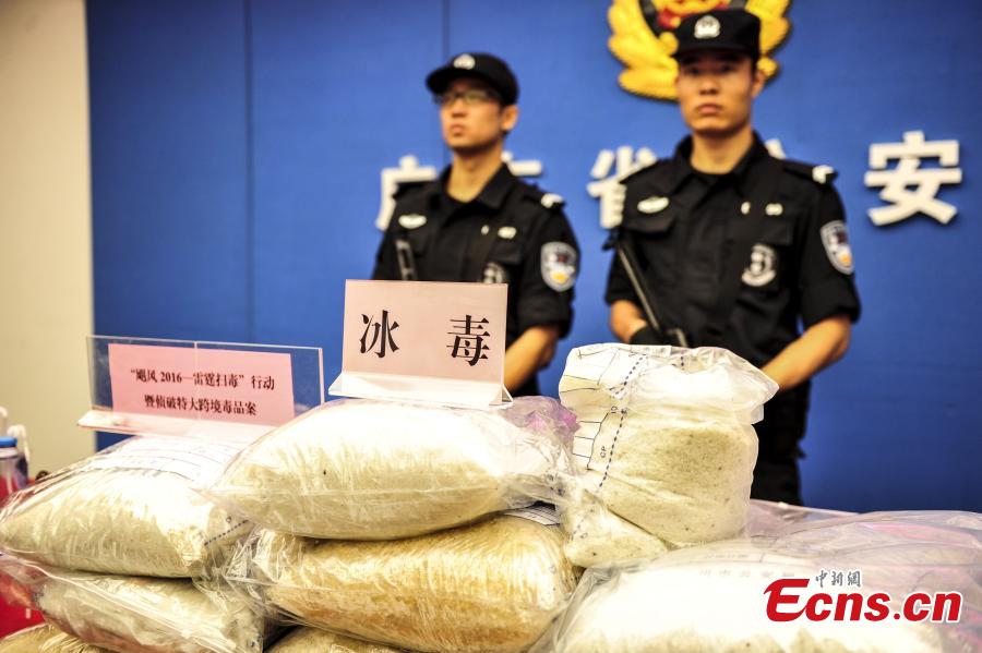 Drugs and drug-making equipment are on display after police busted a cross-border smuggling ring in South China’s Guangdong Province. Local police detained more than 10 suspects, shut down two drug-making sites and confiscated two tons of methamphetamine. In the first nine months, Guangdong police caught 19,000 suspects in drug cases and also disciplined 119,000 drug addicts. (Photo: China News Service/Chen Jimin)