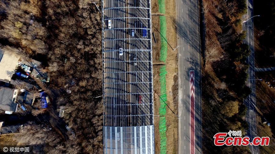 A 1,000-meter-long noise-reduction shelter is seen in Shenyang, Northeast China’s Liaoning province on December 5, 2016. The tunnel built with an investment of 60 million yuan ($8 million) utilizes enclosed acoustic barriers, which effectively reduce the noise pollution caused by heavy traffic. (Photo/CFP)