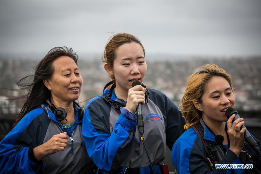 Chinese tourists participate in Bridge Climb at Sydney Harbour Bridge (1/4)