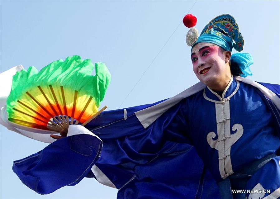 An actor performs Shehuo at a temple fair in Junxian County, central China\'s Henan Province, Feb. 12, 2017. Shehuo is a folk entertainment popular in China. It can be traced back to ancient rituals to worship the earth, which people believe could bring good harvests and fortunes in return. (Xinhua/Li An)