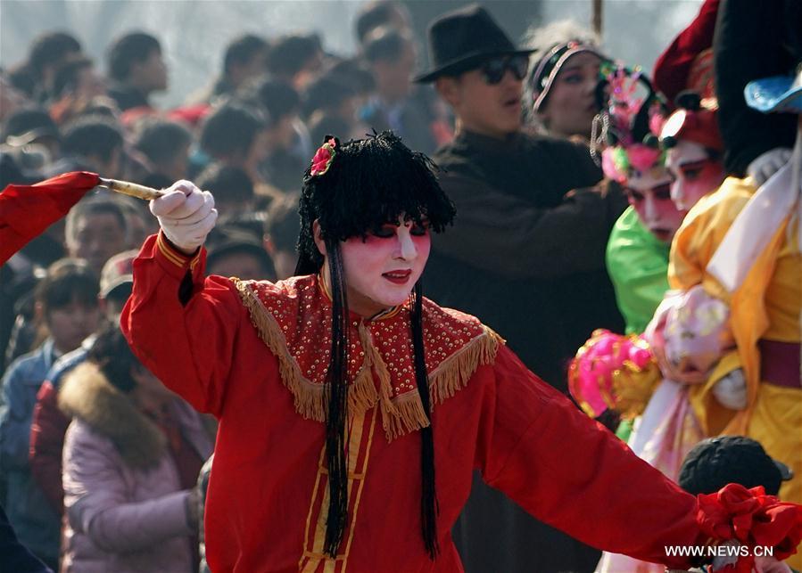 An actor performs Shehuo at a temple fair in Junxian County, central China\'s Henan Province, Feb. 12, 2017. Shehuo is a folk entertainment popular in China. It can be traced back to ancient rituals to worship the earth, which people believe could bring good harvests and fortunes in return. (Xinhua/Li An)