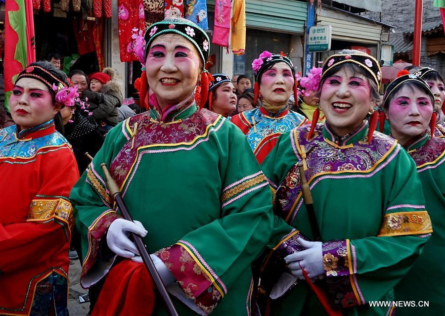 Actors wait to perform Shehuo at a temple fair in Junxian County, central China\'s Henan Province, Feb. 11, 2017. Shehuo is a folk entertainment popular in China. It can be traced back to ancient rituals to worship the earth, which people believe could bring good harvests and fortunes in return. (Xinhua/Li An)