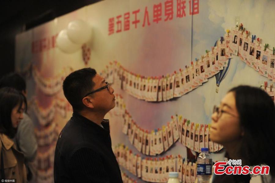 Singles attend a blind date at a hotel in Haidian District, Beijing, April 9, 2017. More than 1,000 single men and women who are studying at top schools such as Peking, Tsinghua and Renmin universities participated the event that lasted for four hours and included five-minute speed dates and games. Some students said they joined the activity because they feel bored alone and regard being in a relationship as a kind of skill. Some participants met about 500 people through the event. The organizer said participants were born in 1999 or earlier. (Photo/CFP)