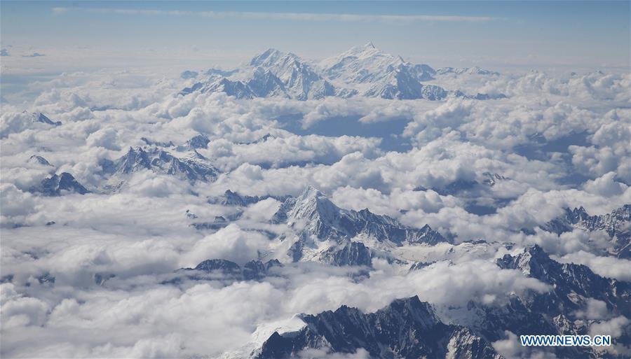 Aerial view of snow mountains in sea of clouds in Tibet(1/3)