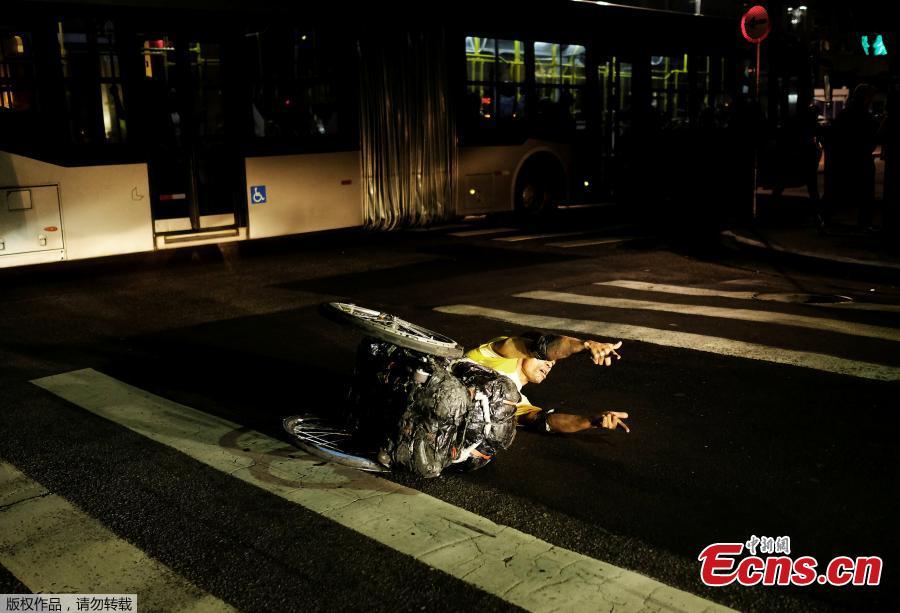 Man dances with a wheelchair in Sao Paulo (1/4)