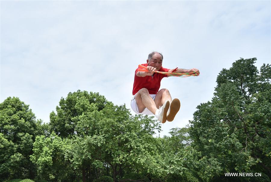 Gao Bi, 68-year-old retired PE teacher, practices rope skipping at a park in Hefei, capital of east China's Anhui Province, Aug. 16, 2017. As a rope skipping enthusiast, Gao Bi has created over 100 kinds of rope skipping techniques. (Xinhua/Yang Xiaoyuan)
