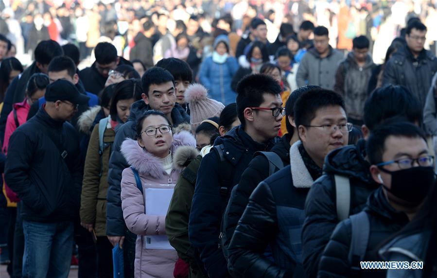 Graduates attend a job fair in Xidian University in Xi\'an, capital of northwest China\'s Shaanxi Province, Jan. 10, 2018. About 8,000 job opportunities were offered to the college graduates at the job fair on Wednesday. Xi\'an will hold more job fairs across the nation until May next year to attract one million college graduates to work in Xi\'an. (Xinhua/Liu Xiao)