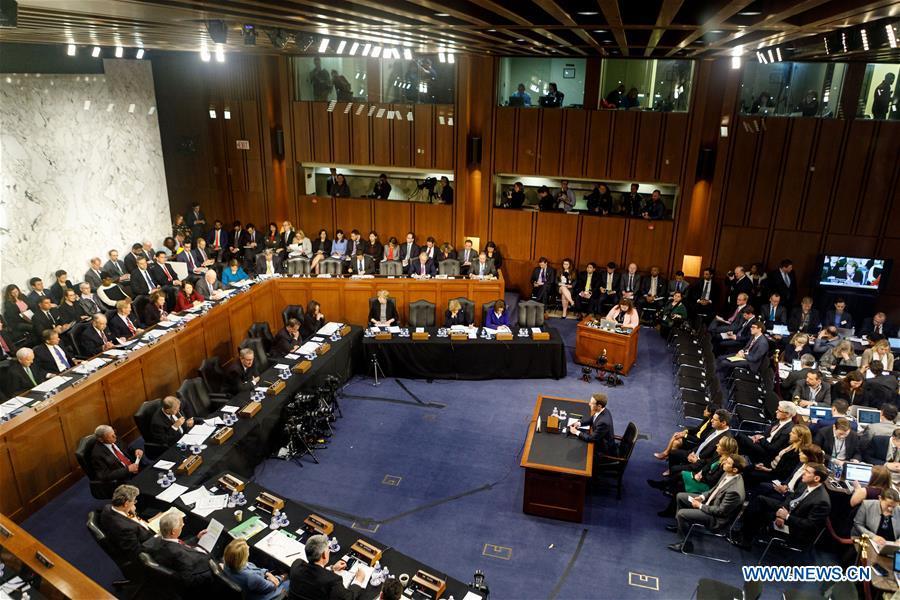 Facebook CEO Mark Zuckerberg (C) testifies at a joint hearing of the Senate Judiciary and Commerce committees on Capitol Hill in Washington D.C., United States, on April 10, 2018. Facebook CEO Mark Zuckerberg told Congress in written testimony on Monday that he is \