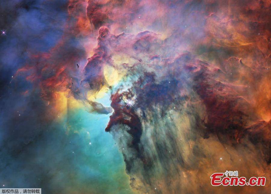 A photo released on April 19, 2018 by the European Space Agency shows this colourful image of the Lagoon Nebula to celebrate the 28th anniversary space of the the NASA/ESA Hubble Space Telescope. The whole nebula, about 4000 light-years away, is an incredible 55 light-years wide and 20 light-years tall. This image shows only a small part of this turbulent star-formation region, about four light-years across. This stunning nebula was first catalogued in 1654 by the Italian astronomer Giovanni Battista Hodierna, who sought to record nebulous objects in the night sky so they would not be mistaken for comets. Since Hodierna\'s observations, the Lagoon Nebula has been photographed and analysed by many telescopes and astronomers all over the world. The observations were taken by Hubble\'s Wide Field Camera 3 between 12 February and 18 February 2018. (Photo/Agencies)