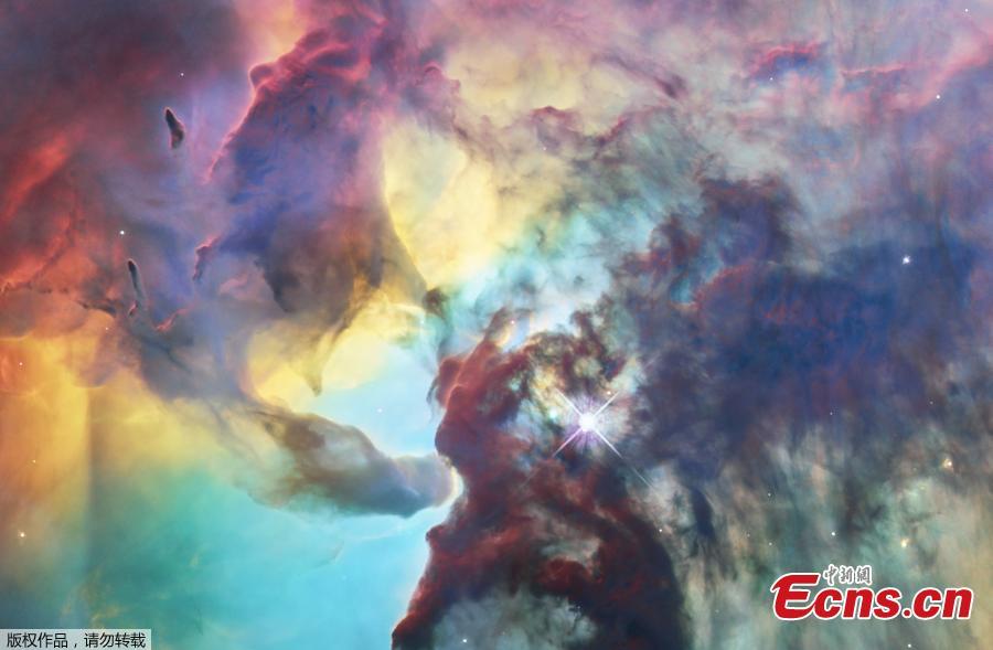 A photo released on April 19, 2018 by the European Space Agency shows this colourful image of the Lagoon Nebula to celebrate the 28th anniversary space of the the NASA/ESA Hubble Space Telescope. The whole nebula, about 4000 light-years away, is an incredible 55 light-years wide and 20 light-years tall. This image shows only a small part of this turbulent star-formation region, about four light-years across. This stunning nebula was first catalogued in 1654 by the Italian astronomer Giovanni Battista Hodierna, who sought to record nebulous objects in the night sky so they would not be mistaken for comets. Since Hodierna\'s observations, the Lagoon Nebula has been photographed and analysed by many telescopes and astronomers all over the world. The observations were taken by Hubble\'s Wide Field Camera 3 between 12 February and 18 February 2018. (Photo/Agencies)
