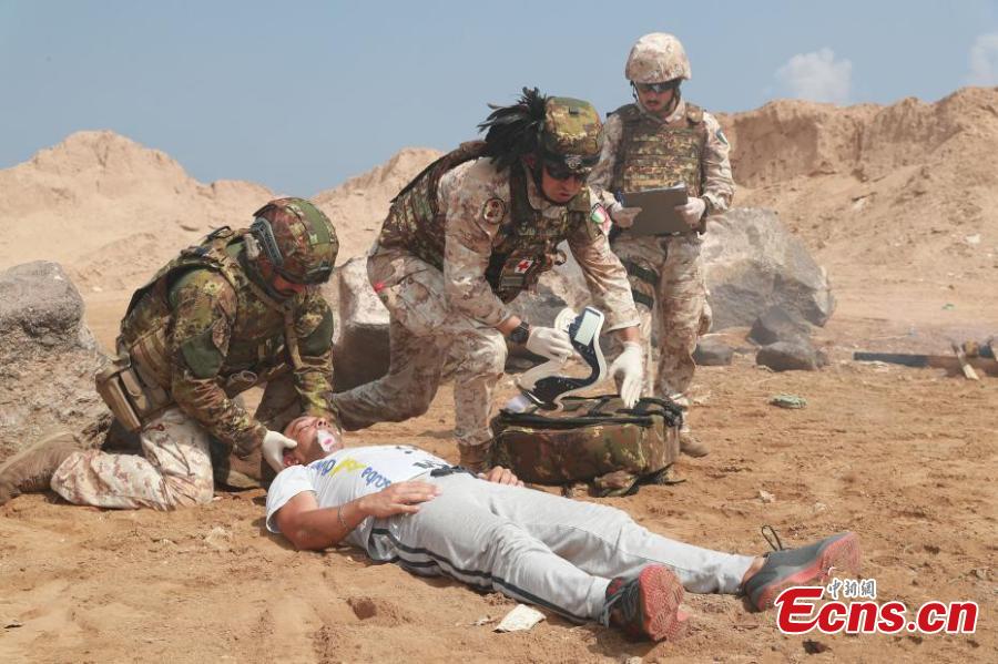 Medical teams participate in a joint training exercise by the local PLA support base and the Italian National Support Military Base in Djibouti on Wednesday, April 25, 2018.(Photo: China News Service/Tan Longlong)