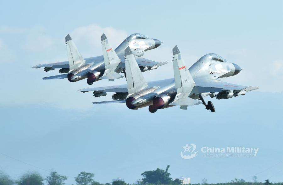 Two fighter jets attached to an aviation brigade of the South China Sea Fleet under the PLA Navy take off in formation for a live-fire training exercise at a shooting range in the South China Sea from May 17 to 18, 2018. (Photo/eng.chinamil.com.cn)