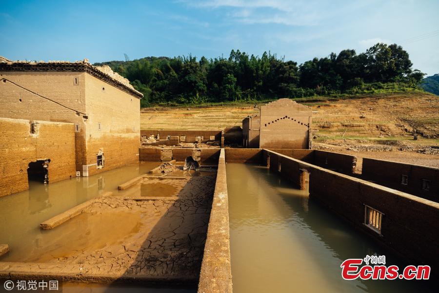 The ruins of a village emerge from the Tiantangshan reservoir after water drops in Longmen County, South China’s Guangdong Province. The village was submerged by water in 1992 while local residents were relocated. (Photo/VCG)