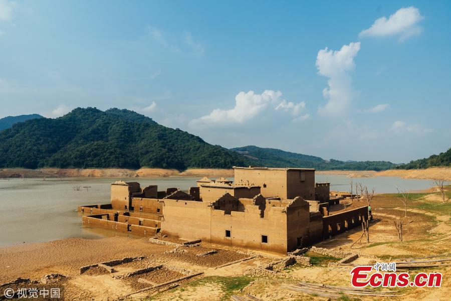 The ruins of a village emerge from the Tiantangshan reservoir after water drops in Longmen County, South China’s Guangdong Province. The village was submerged by water in 1992 while local residents were relocated. (Photo/VCG)