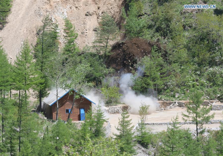 Photo taken on May 24, 2018 shows explosions of the No. 2 tunnel at the nuclear test site of Punggye-ri, the Democratic People\'s Republic of Korea. The Democratic People\'s Republic of Korea has confirmed the demolition of its nuclear test site at Punggye-ri on Thursday, saying that all the tunnels have been collapsed by explosions and their entrances completely closed, according to the Korean Central News Agency (KCNA). (Xinhua/Cheng Dayu)