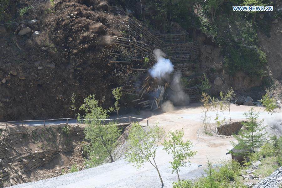Photo taken on May 24, 2018 shows explosions of the No. 4 tunnel at the nuclear test site of Punggye-ri, the Democratic People\'s Republic of Korea. The Democratic People\'s Republic of Korea has confirmed the demolition of its nuclear test site at Punggye-ri on Thursday, saying that all the tunnels have been collapsed by explosions and their entrances completely closed, according to the Korean Central News Agency (KCNA). (Xinhua/Cheng Dayu)