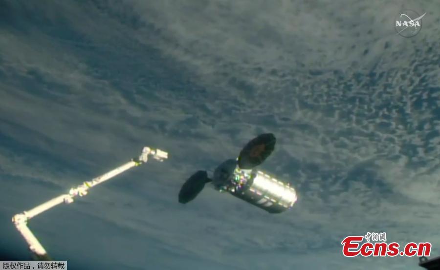The uncrewed Orbital ATK Cygnus cargo ship S.S. J.R. Thompson is captured by a robotic arm at the International Space Station on May 24, 2018. The Cygnus delivered more than 3 tons of supplies to the station\'s Expedition 55 crew. (Photo/NASA)