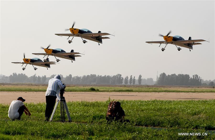 Jets piloted by aviation enthusiasts take off during a rehearsal for the 10th Air Sports Cultural Tourism Festival in Anyang, central China\'s Henan Province, May 24, 2018. The three-day air show begins on May 25. (Xinhua/Li An)