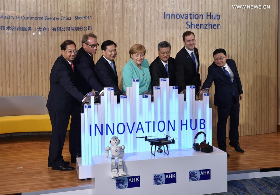 German Chancellor Angela Merkel (C) attends the opening ceremony of the Shenzhen innovation hub of the German Industry and Commerce Ltd. in Shenzhen, south China\'s Guangdong Province, May 25, 2018. (Xinhua/Mao Siqian)
