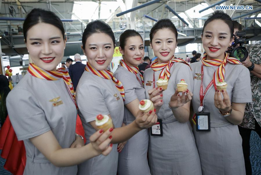 Flight attendants of China\'s Hainan Airlines pose for photos after they arrived at Vancouver International Airport in Vancouver, Canada, May 25, 2018. A direct flight between Tianjin and Vancouver was launched on Friday. Flight HU7959, operated by Hainan Airlines, is the first direct passenger air route linking Tianjin with North America. (Xinhua/Liang Sen)
