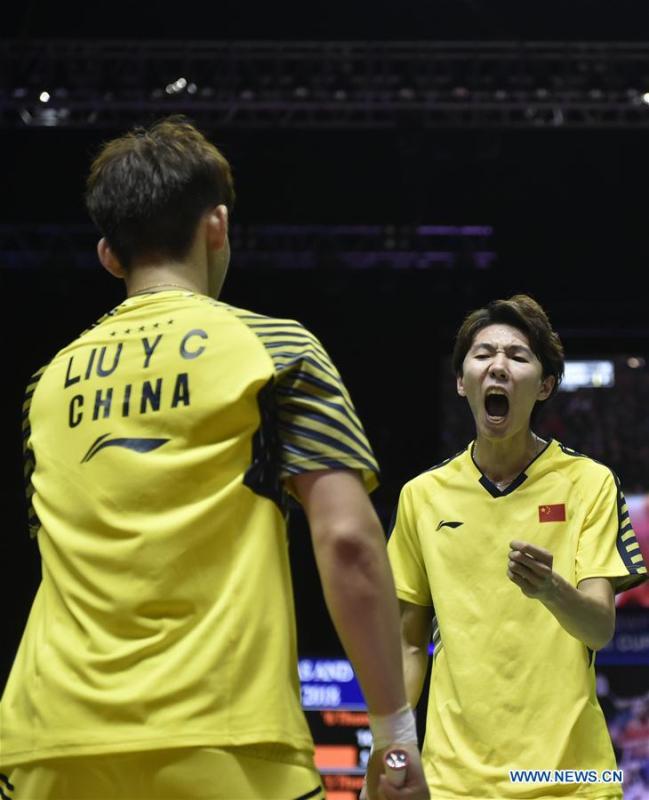 Li Junhui (R) and Liu Yuchen of team China celebrate after winning the BWF Thomas Cup 2018 semifinal against Mohammad Ahsan and Hendra Setiawan of team Indonesia in Bangkok, Thailand, on May 25, 2018. Team China advanced to the final with 3-1.(Xinhua/Wang Shen)
