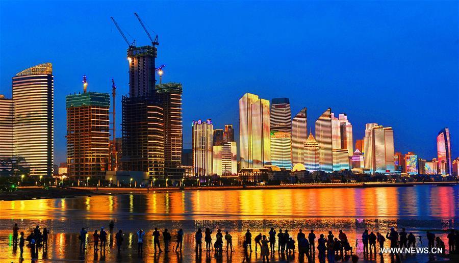Photo taken on May 26, 2018 shows a night view of the Qianhai area in Qingdao, a coastal city in east China\'s Shandong Province which will host a summit of the Shanghai Cooperation Organization next month. (Xinhua/Wang Haibin)