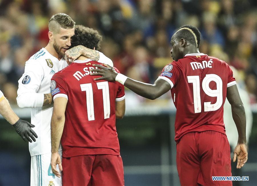 Sergio Ramos (L) of Real Madrid hugs Mohamed Salah of Liverpool during the UEFA Champions League final match between Liverpool and Real Madrid in Kiev, Ukraine on May 26, 2018. Real Madrid claimed the title with 3-1. (Xinhua/Wuzhuang)