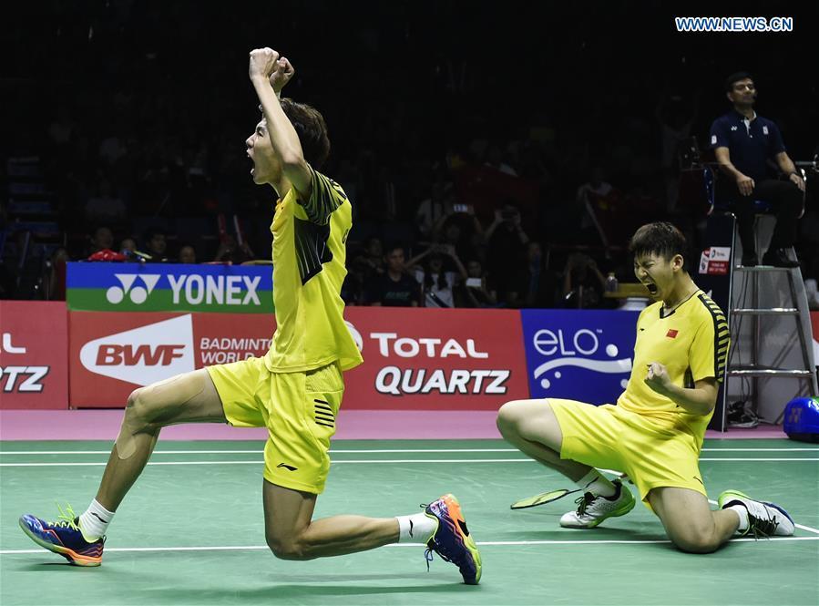 China\'s Li Junhui (L)/Liu Yuchen celebrate after winning the doubles match against Japan\'s Keigo Sonoda/Yuta Watanabe in the final of the Thomas Cup badminton tournament in Bangkok, Thailand, on May 27, 2018. Team China won the final 3-1 and claimed the title of the event. (Xinhua/Wang Shen)