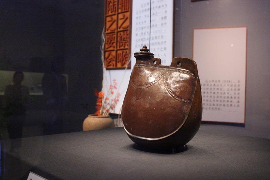 The exhibition of 169 displays at the Capital Museum in Beijing includes such items as a Qing Dynasty (1644-1911) map of the Grand Canal, and other cultural relics like daily items, pottery and construction materials. (Photo provided to China Daily)

In 1329, as much as 3.5 million dan (a container that could hold about 75 kilograms) of rice was transported via the canal from southern China to Beijing.

In 2014, a section of canal in Tongzhou was put on the UNESCO World Heritage List.

Gao says that Tongzhou was a crucial link both during the Ming (1368-1644) and Qing (1644-1911) dynasties. And this is highlighted by some of the items on display like a plate used to weigh rice at Tongzhou\'s port.

There is a list of codes on display that shows there was a complicated system to check food quality and prevent fraud.

The Tongzhou District Museum also contributed some exhibits.

Zheng Xusheng, head of the museum, talks about a Qing map of the Grand Canal, from Beijing to Shandong province, from the reign of Yongzheng (1722-35).

According to Zheng, the map was taken to Japan during the War of Resistance Against Japanese Aggression (1931-45) but was brought back to China around 2000.

\