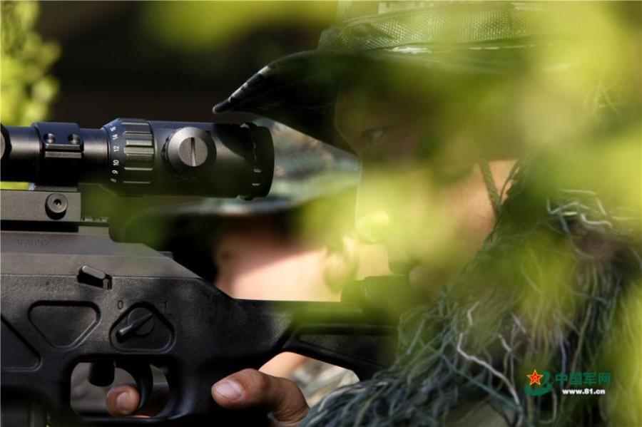 Photo taken on May 28, 2018 at the Great Wall 2018 Anti-terror International Forum shows Special Police of China members demonstrating anti-terror training programs at the Special Police Academy of the Chinese People\'s Armed Police Force in Beijing. The training included shooting and forced airplane cabin entry. (Photo/81.cn)