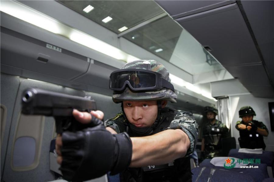 Photo taken on May 28, 2018 at the Great Wall 2018 Anti-terror International Forum shows Special Police of China members demonstrating anti-terror training programs at the Special Police Academy of the Chinese People\'s Armed Police Force in Beijing. The training included shooting and forced airplane cabin entry. (Photo/81.cn)