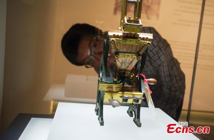 Visitors view items in the Spirit of Invention: Nineteenth-Century U.S. Patent Models from the Hagley Museum and Library exhibition at the National Museum of China in Beijing, June 3, 2018. The exhibition presented 60 of Hagley’s 19th-century patent models. (Photo: China News Service/Jia Tianyong)