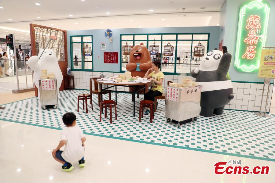 Grizzly, Panda and Ice Bear from Cartoon Network’s We Bare Bears are having their first working holiday at LCX, Ocean Terminal in Hong Kong. Visitors can snap a selfie with them as they visit a famous local teahouse, herbal tea kiosk, traditional grocery store and egg waffles stall. Their visit runs until June 17. (Photo: China News Service/Hong Shaokui)
