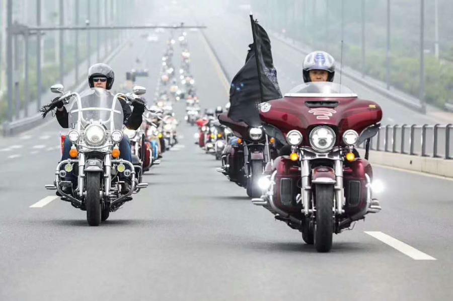 Riders on Harley-Davidson motorcycles parade through an auto park in Chengdu City, Southwest China’s Sichuan Province, June 3, 2018. More than 100 participants rode Harley-Davidson motorcycles for the second stop of the 2018 Freedom Tour. (Photo: China News Service/Zhong Xin)