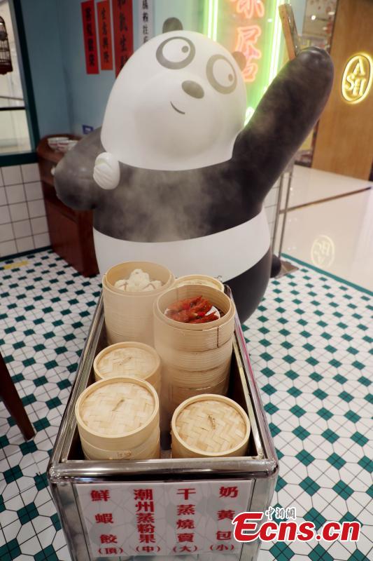 Grizzly, Panda and Ice Bear from Cartoon Network’s We Bare Bears are having their first working holiday at LCX, Ocean Terminal in Hong Kong. Visitors can snap a selfie with them as they visit a famous local teahouse, herbal tea kiosk, traditional grocery store and egg waffles stall. Their visit runs until June 17. (Photo: China News Service/Hong Shaokui)