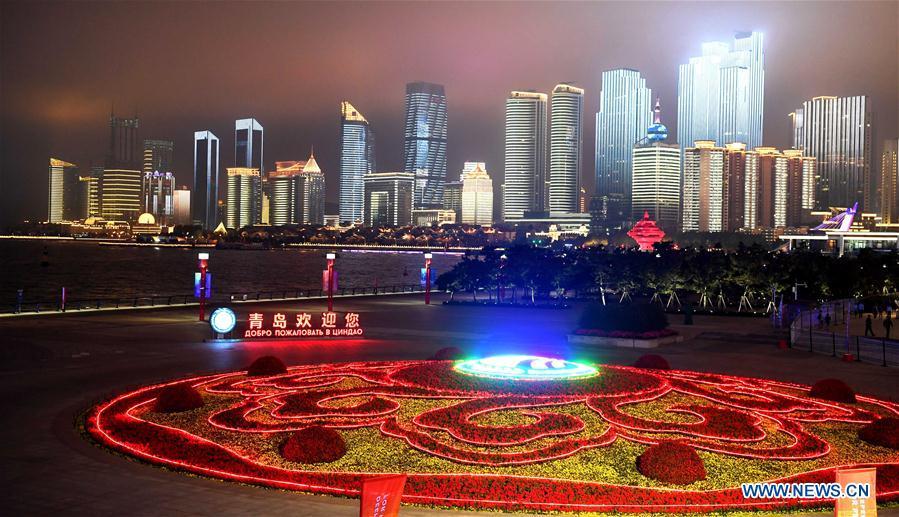 Panorama photo taken on June 2, 2018 shows the night view of Wusi Square in Qingdao, east China\'s Shandong Province. The 18th Shanghai Cooperation Organization (SCO) Summit is scheduled for June 9 to 10 in Qingdao. (Xinhua/Yin Gang)