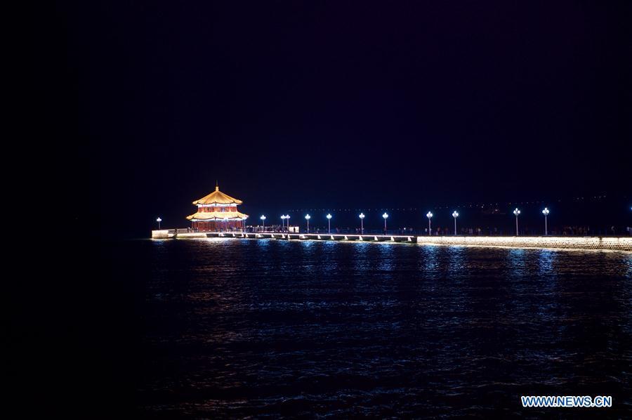 Photo taken on June 4, 2018 shows the night view of Zhanqiao Pier in Qingdao, east China\'s Shandong Province. The 18th Shanghai Cooperation Organization (SCO) Summit is scheduled for June 9 to 10 in Qingdao. (Xinhua/Jiang Kehong)