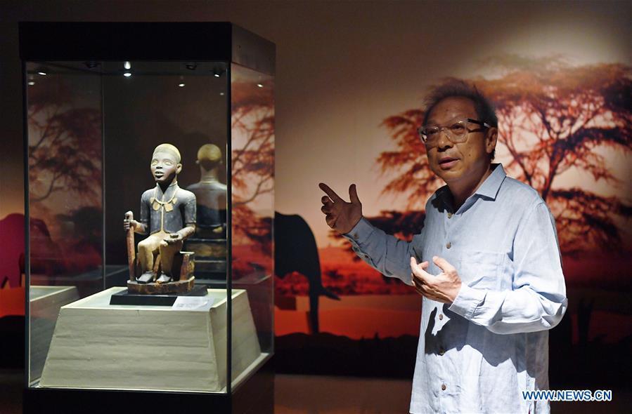 A curator introduces the African Art Exhibition held in southwest China\'s Chongqing, June 7, 2018. The exhibition will open to the public from June 8 to Sept. 9. (Xinhua/Wang Quanchao)