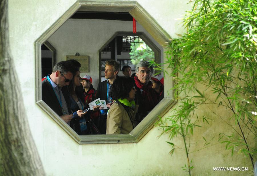 European representatives attending the fourth China-Europe High-Level Political Party Forum visit Liuyuan or Lingering Garden in Suzhou, east China\'s Jiangsu Province, April 22, 2013.(Xinhua/Shen Peng)

13. Classical Gardens of Suzhou

Classical Chinese garden design, which seeks to recreate miniature natural landscapes, is not illustrated any better than in the nine gardens in the historic city of Suzhou, Jiangsu province.

Suzhou’s classical gardens are noted for their exquisite design and layout. Landscape and buildings are perfectly integrated to create a great harmony between man and nature.

They were added onto the World Cultural Heritage List in 1997.