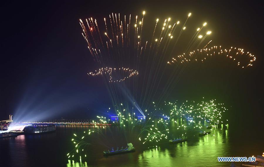 A lights and fireworks show takes place in Qingdao, the host city of the 18th Shanghai Cooperation Organization (SCO) summit, in east China\'s Shandong Province, June 9, 2018. (Xinhua/Jiang Kehong)