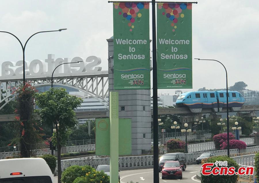 A tram runs on Sentosa Island, Asia\'s leading leisure destination and Singapore\'s premier island getaway, June 10, 2018. (Photo: China News Service/Meng Xiangjun)