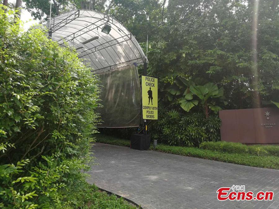 A sign for a police check stands near the Capella Resort on Sentosa Island, Singapore, June 10, 2018. (Photo: China News Service/Meng Xiangjun)