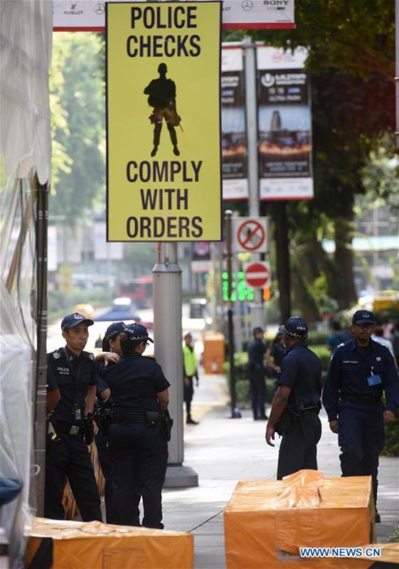 Security members guard outside the hotel of the guests in Singapore, June 11, 2018. The much-anticipated meeting between U.S. President Donald Trump and Kim Jong Un, top leader of the Democratic People\'s Republic of Korea (DPRK) is to start here on Tuesday. (Xinhua/Qin Qing)