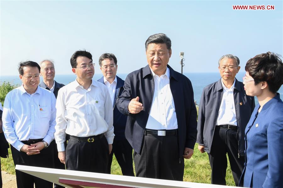 Chinese President Xi Jinping, also general secretary of the Communist Party of China Central Committee and chairman of the Central Military Commission, visits a fort relic site on Liugong Island during an inspection tour in Weihai, east China\'s Shandong Province, June 12, 2018. (Xinhua/Li Xueren)