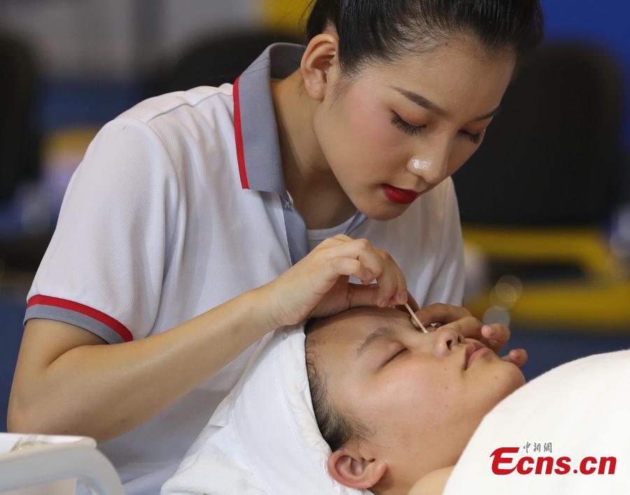 A scene from the WorldSkills China National Competition in Shanghai, June 13, 2018. A total of 897 skilled professionals from across the country will compete in 34 programs including carpentry, floriculture, gem cutting, baking and panel beating. The winners will represent China at the 46th WorldSkills Competition in 2021. WorldSkills aims to raise the profile and recognition of skilled people and show how important skills are in achieving economic growth and personal success, according to its official website. (Photo: China News Service/Zhang Hengwei)