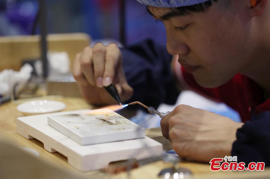 A scene from the WorldSkills China National Competition in Shanghai, June 13, 2018. A total of 897 skilled professionals from across the country will compete in 34 programs including carpentry, floriculture, gem cutting, baking and panel beating. The winners will represent China at the 46th WorldSkills Competition in 2021. WorldSkills aims to raise the profile and recognition of skilled people and show how important skills are in achieving economic growth and personal success, according to its official website. (Photo: China News Service/Zhang Hengwei)